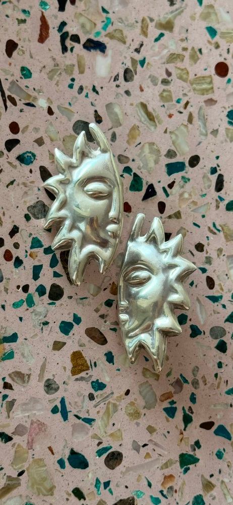 
                  
                    Silver Sol Earrings
                  
                